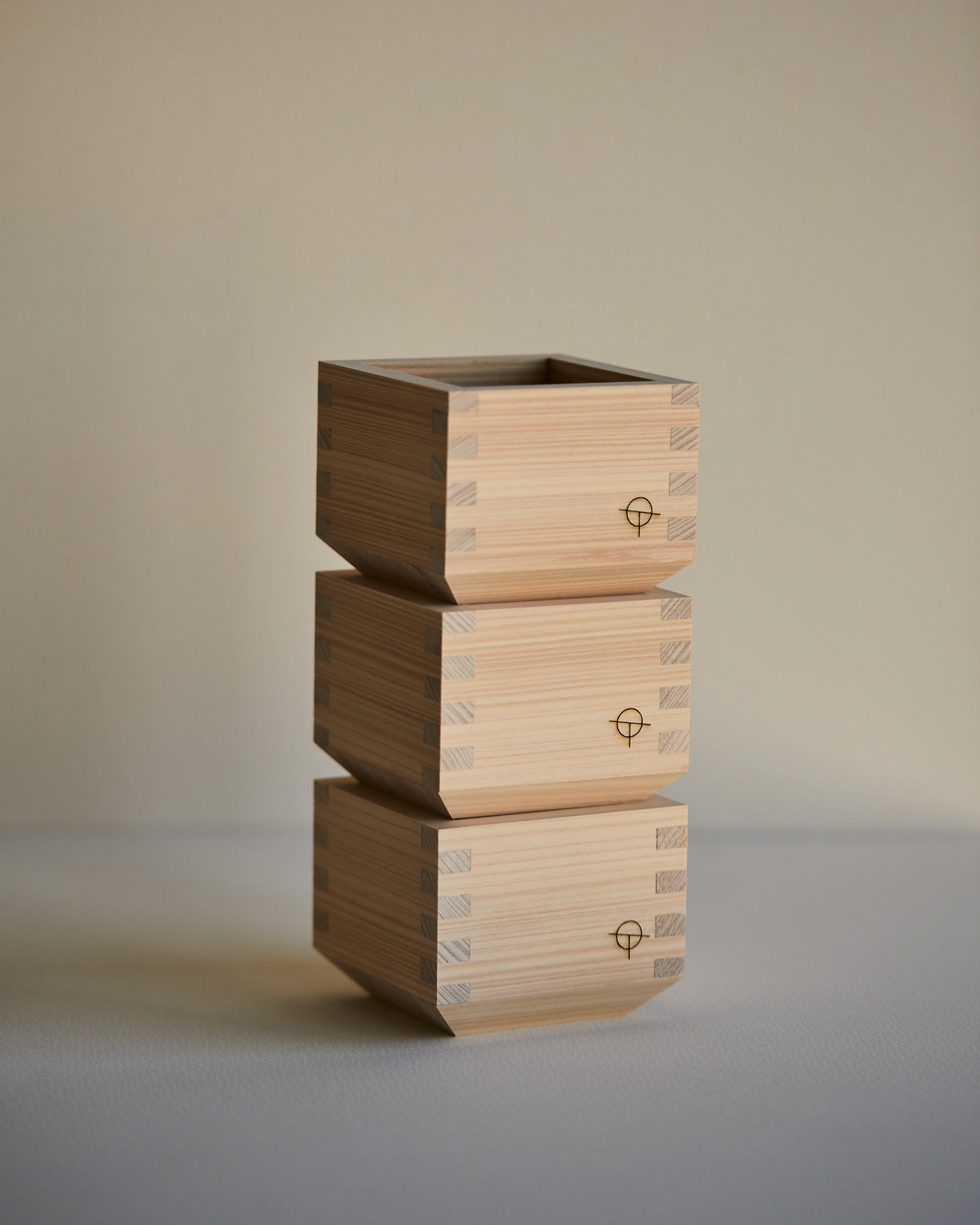 Three Hinoki sake cups stacked in a column
